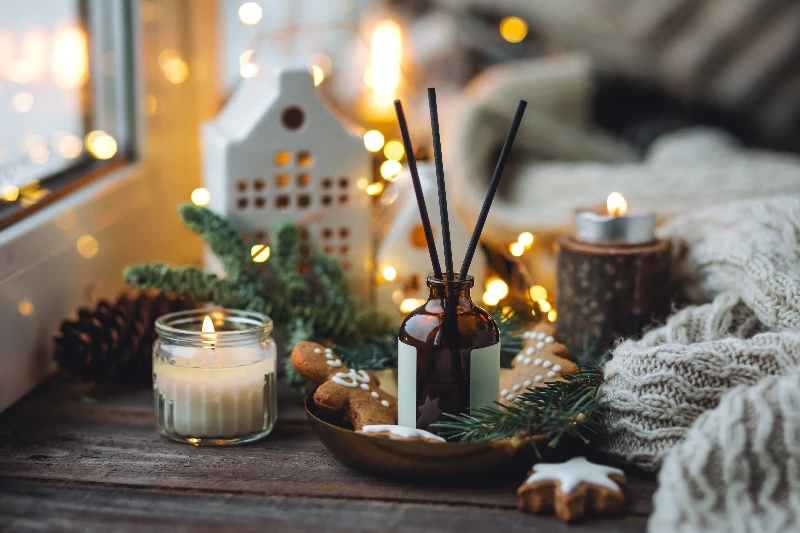 Interior of dark living room with glowing lamps and Christmas tree